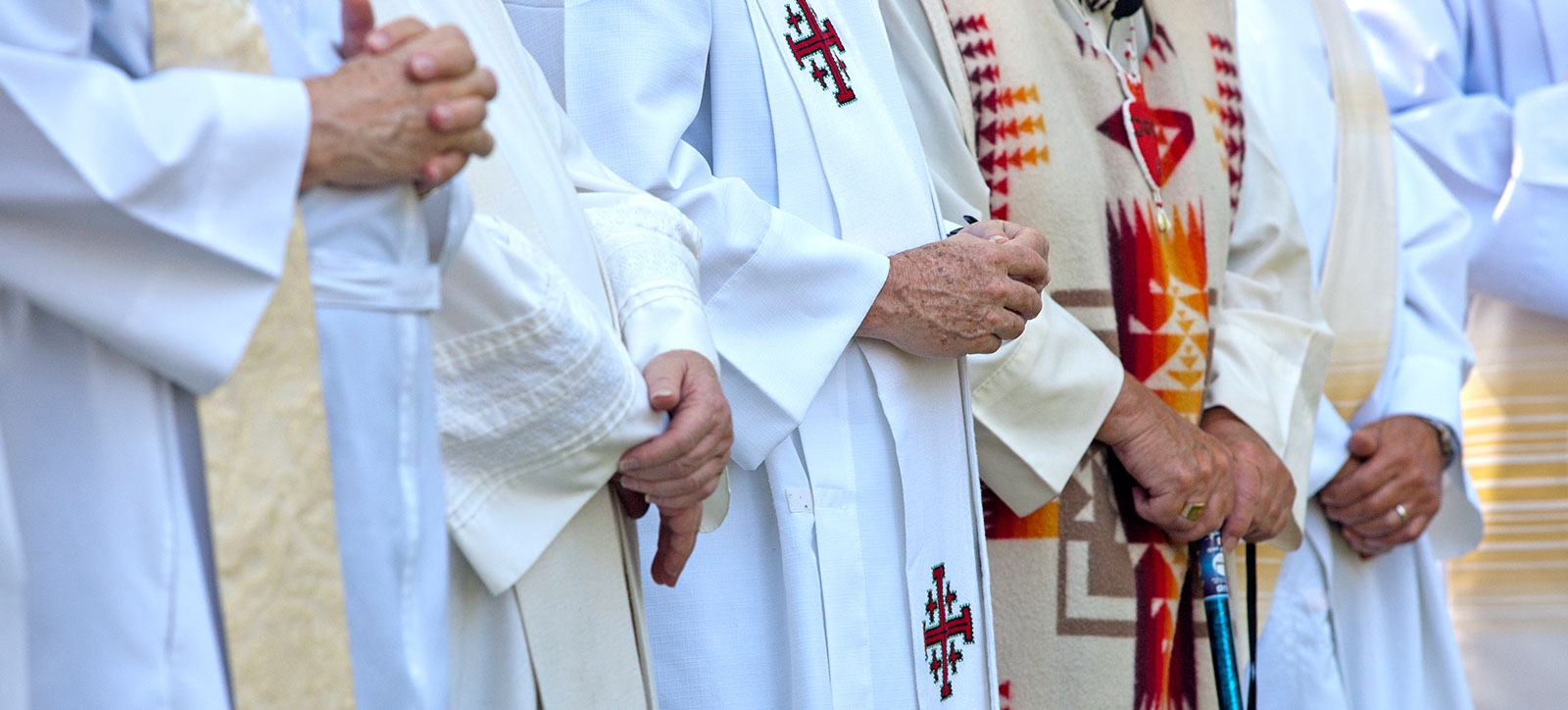Priests with folded hands