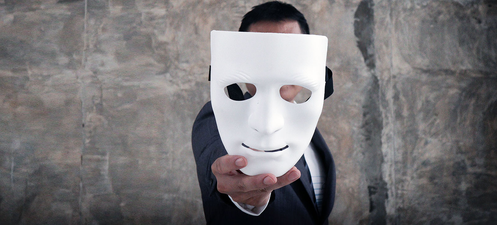 A man holding a mask A man holding a mask