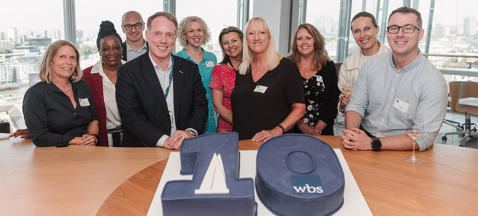 Pro-Deans Ross Ritchie and Jacky Swan in front of a giant birthday cake and surrounded by staff, alumni and academics Pro-Deans Ross Ritchie and Jacky Swan in front of a giant birthday cake and surrounded by staff, alumni and academics